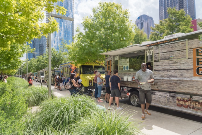 Food truck vendor with customers at Klyde Park in Downtown Dallas