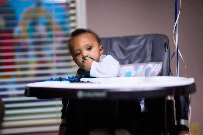 Kid in highchair at mealtime