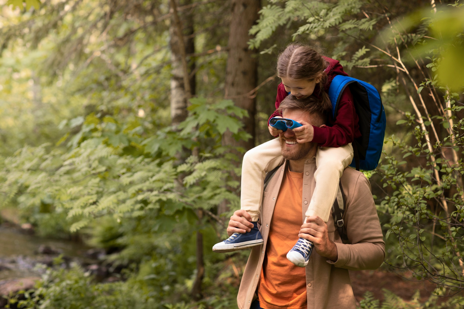 Father and Daughter Having Fun in the Forest