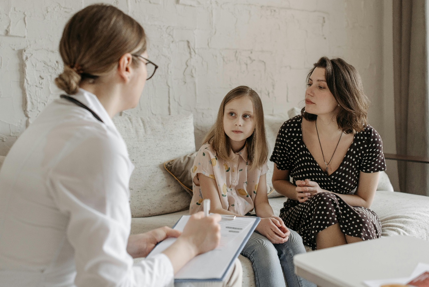 daughter with mum and doctor