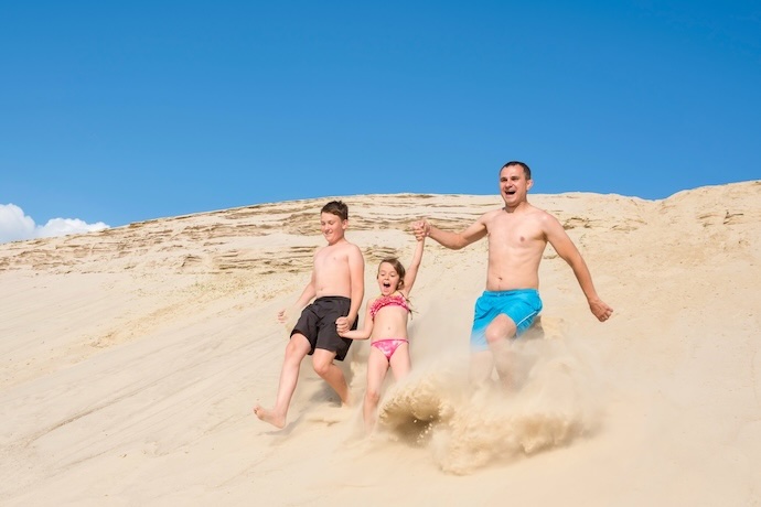 family at beach in sand