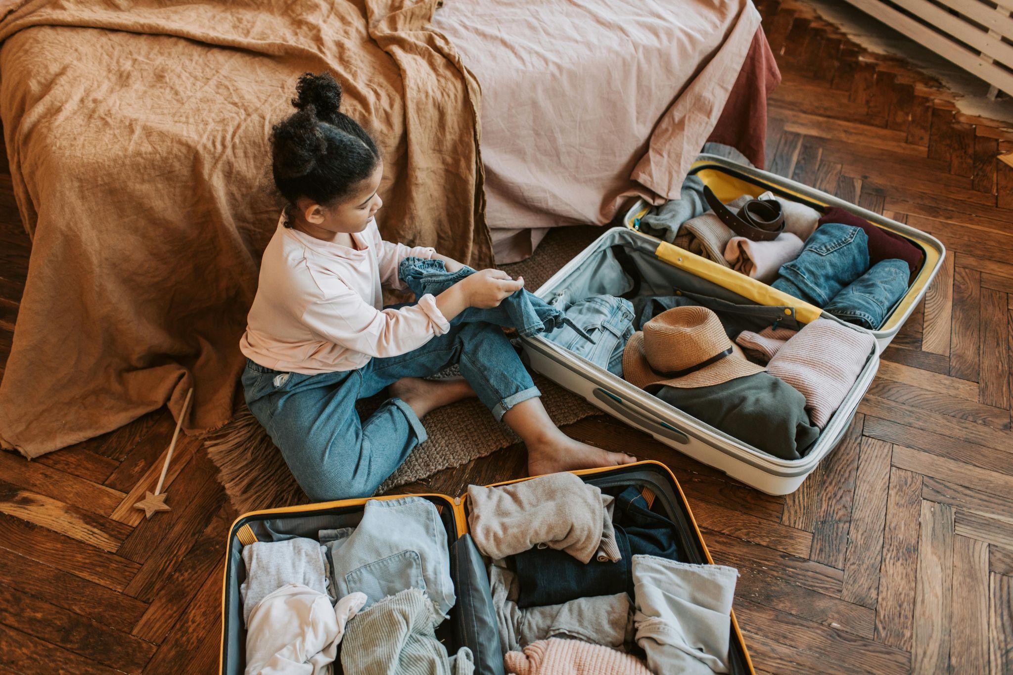young girl packing bags