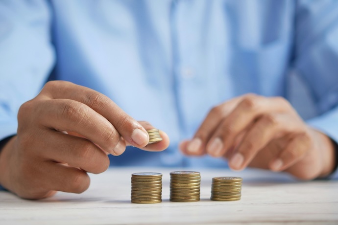 hand balancing coins