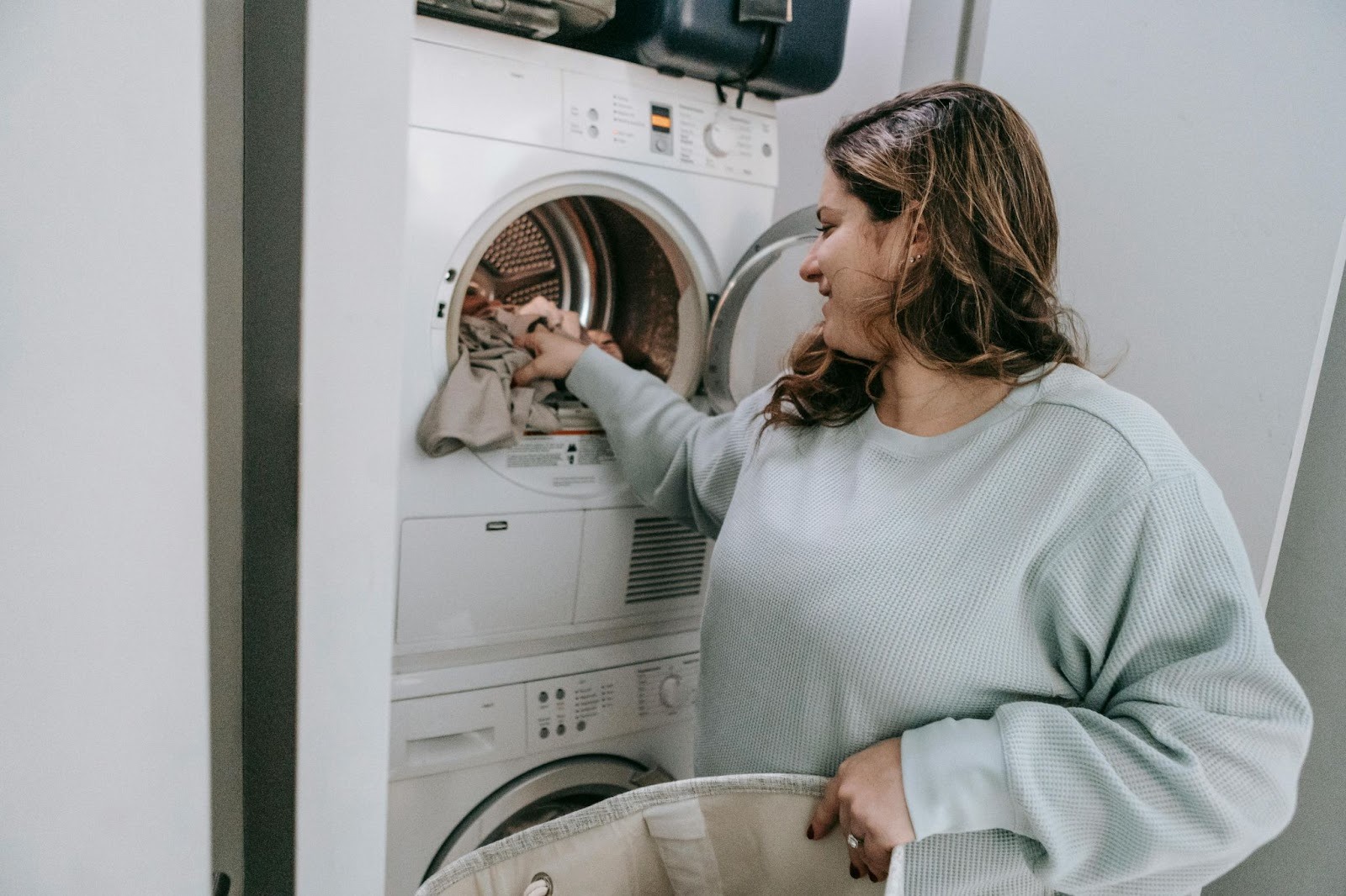 mom loads washing machine