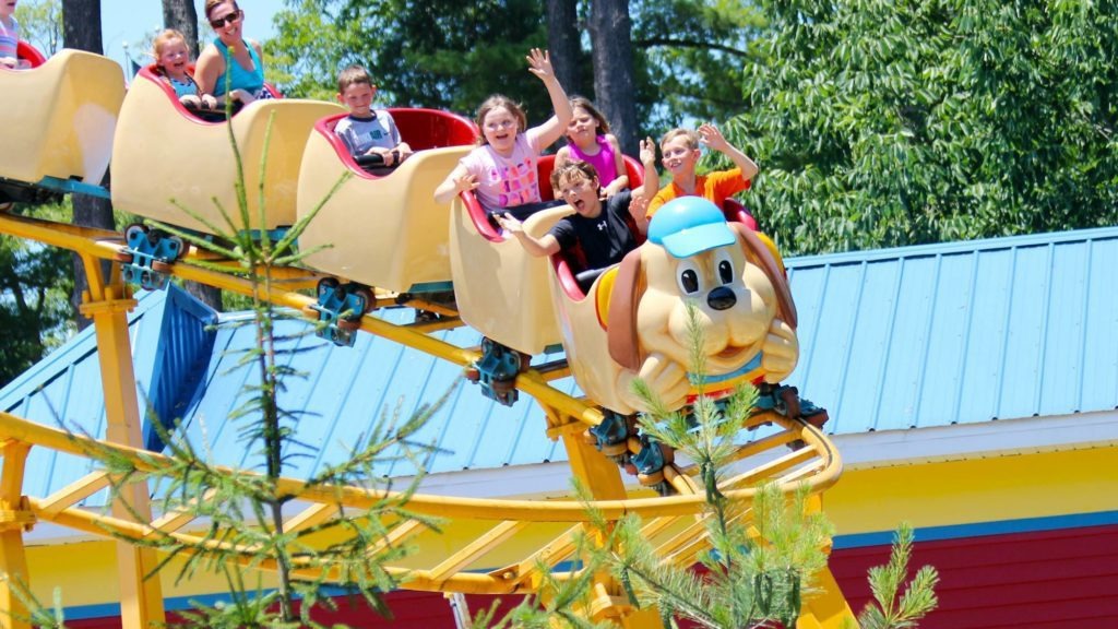 kids on a themepark ride