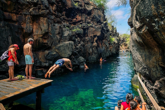 kids diving into clear water