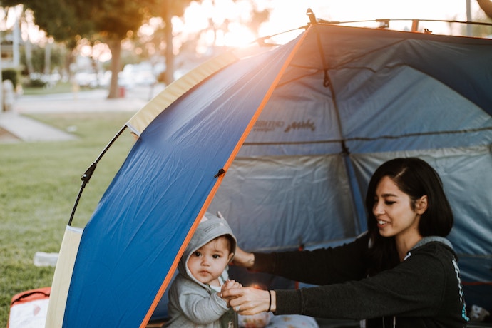 mom and son enjoy camping