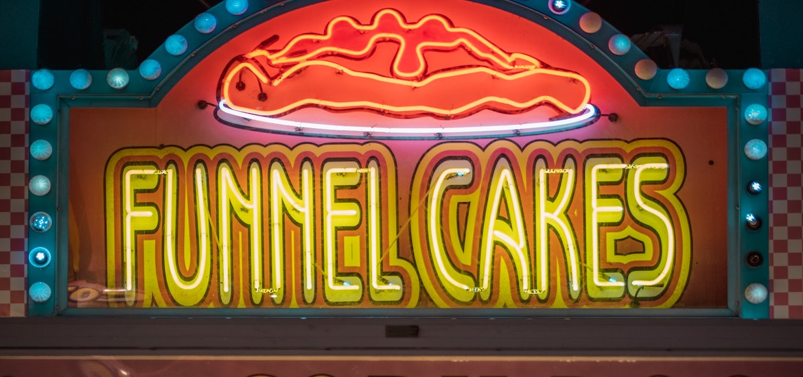 A close up of a funnel cakes sign