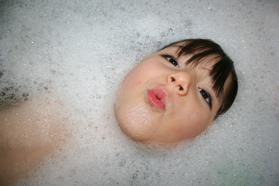 kid takes a bubble bath