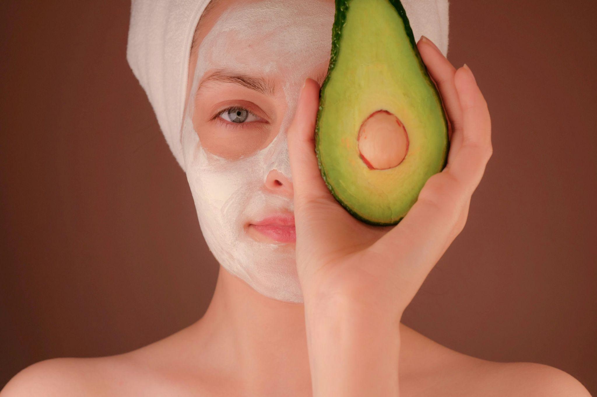 woman applying skincare regime