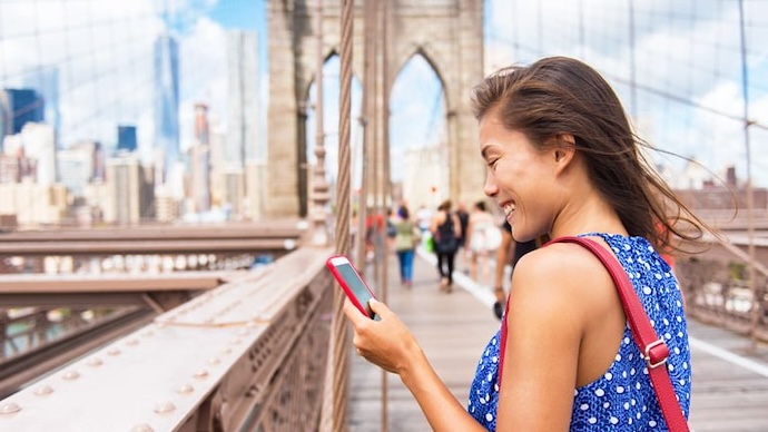 Woman on phone Brooklyn Bridge