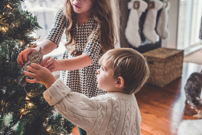 young kids decorate xmas tree