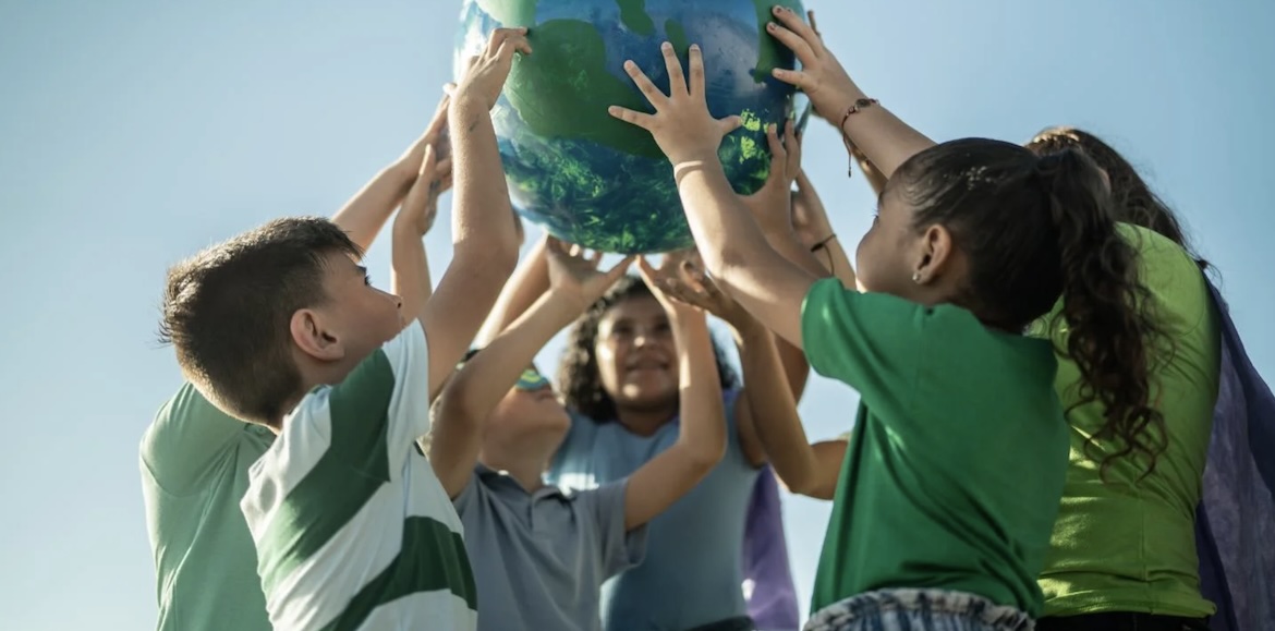 kids holding a globe