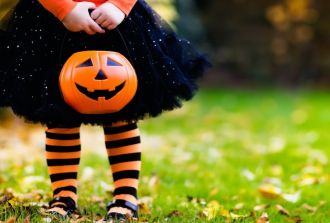 halloween, blog, halloween for kids, girl holding pumpkin at Halloween