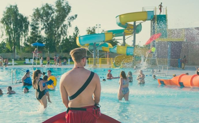 a lifeguard watches over a waterpark