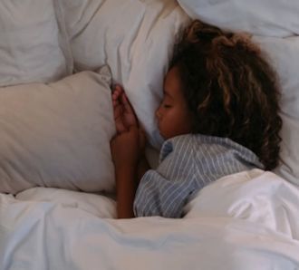 Child sleeping in bed