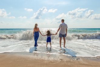 a family play in the sea on a beautiful day