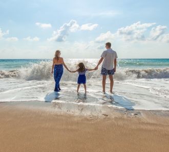 a family on a beach together