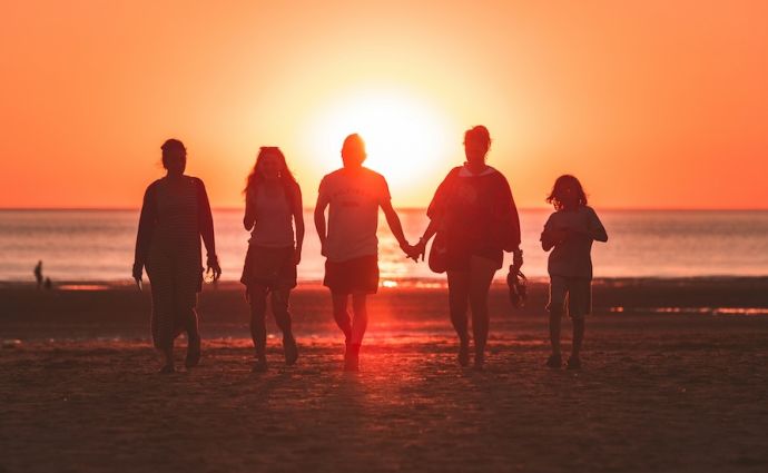 family at sunset on beach
