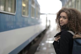 Female student about to board train
