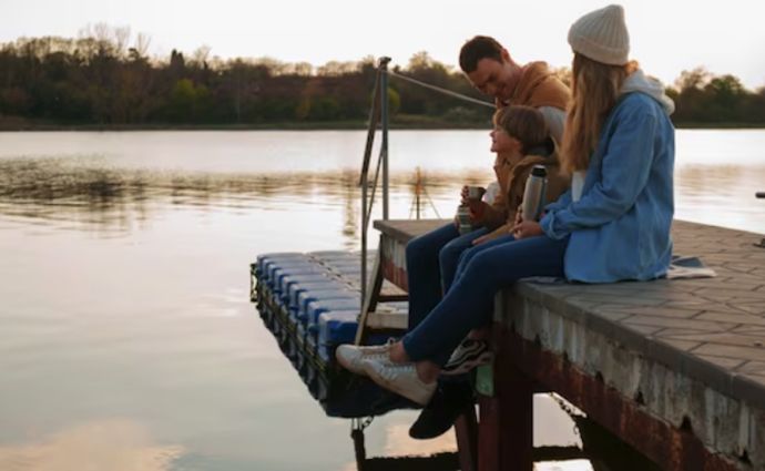 family fishing on pier