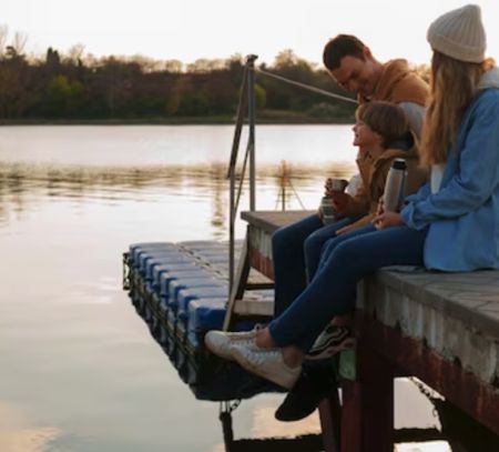 family fishing on pier