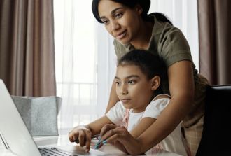 Mom and daughter on laptop