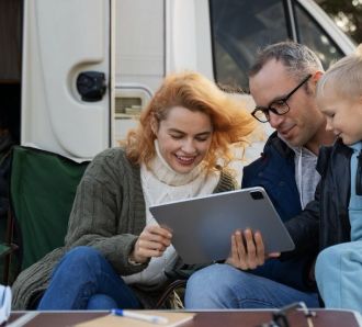 family outside RV