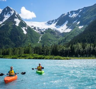 anchorage lake mountains kayakers kayaking blue sky anchorage city guide family days out