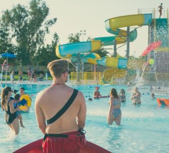 a lifeguard watches over a waterpark