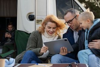 family outside RV
