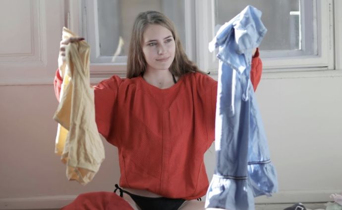 a woman sorts washing