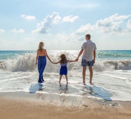 a family play in the sea on a beautiful day