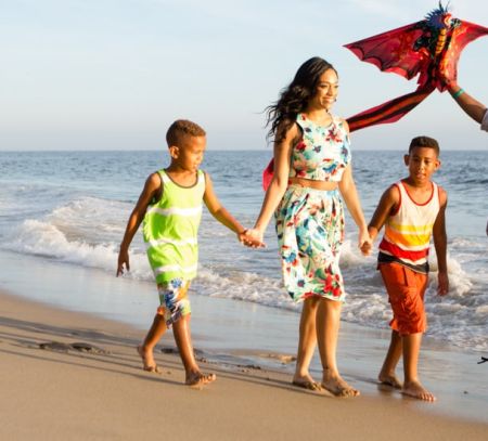 Family walking down the beach in Los Angeles