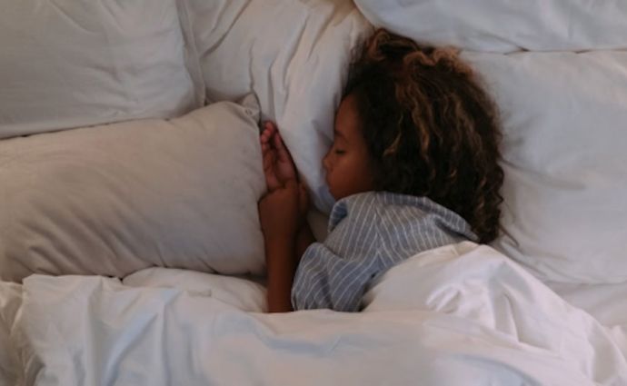 Child sleeping in bed