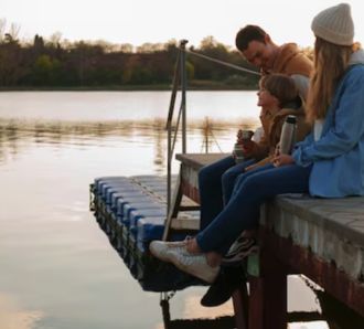 family fishing on pier
