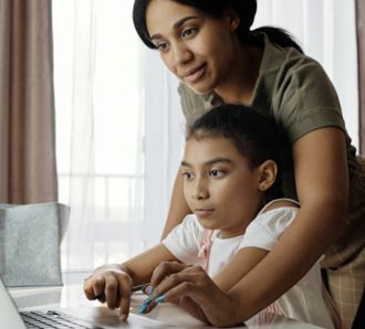 Mom and daughter on laptop