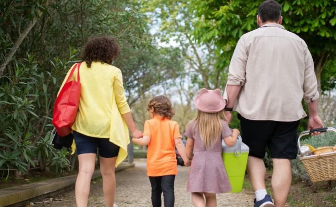 A family walks for a picnic