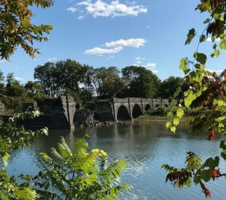 A view across the water at the stonework remains of the Schoharie Creek Aqueduct