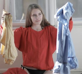 a woman sorts washing