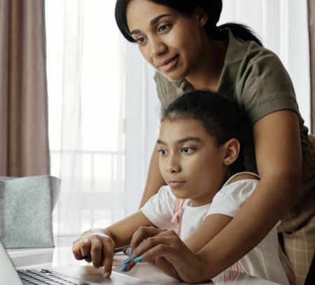 Mom and daughter on laptop