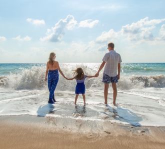 a family play in the sea on a beautiful day