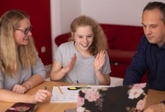 Parents coaching kid for exams