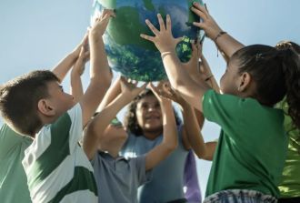 kids holding a globe
