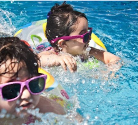 Kids in pool wearing glasses