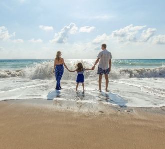 a family on a beach on holiday