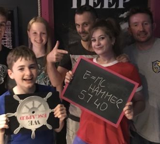 a family enjoy an escape room