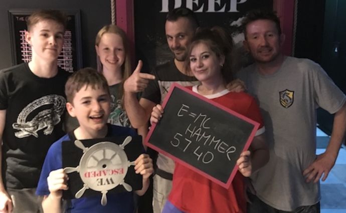 a family enjoy an escape room