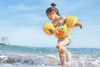 girl playing on a beach