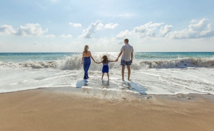 a family on a beach on holiday